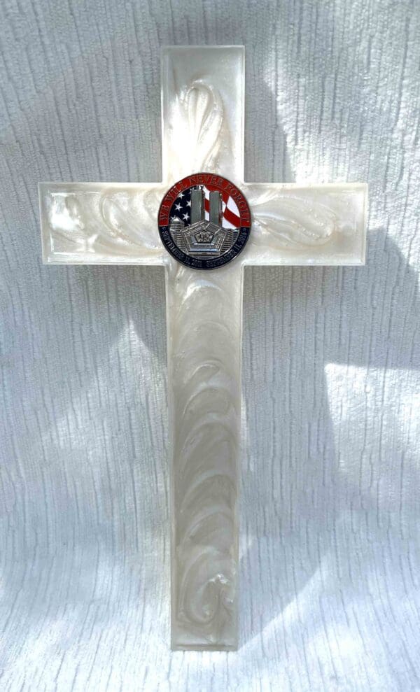 White cross with 9/11 coin